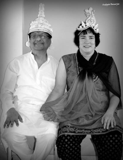 My husband and I try on headpieces worn by an Indian bride and groom
